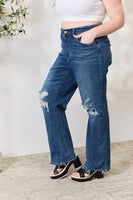 Niebieskie, proste dżinsy Judy z wysokim stanem i przetarciami w stylu lat 90-tych